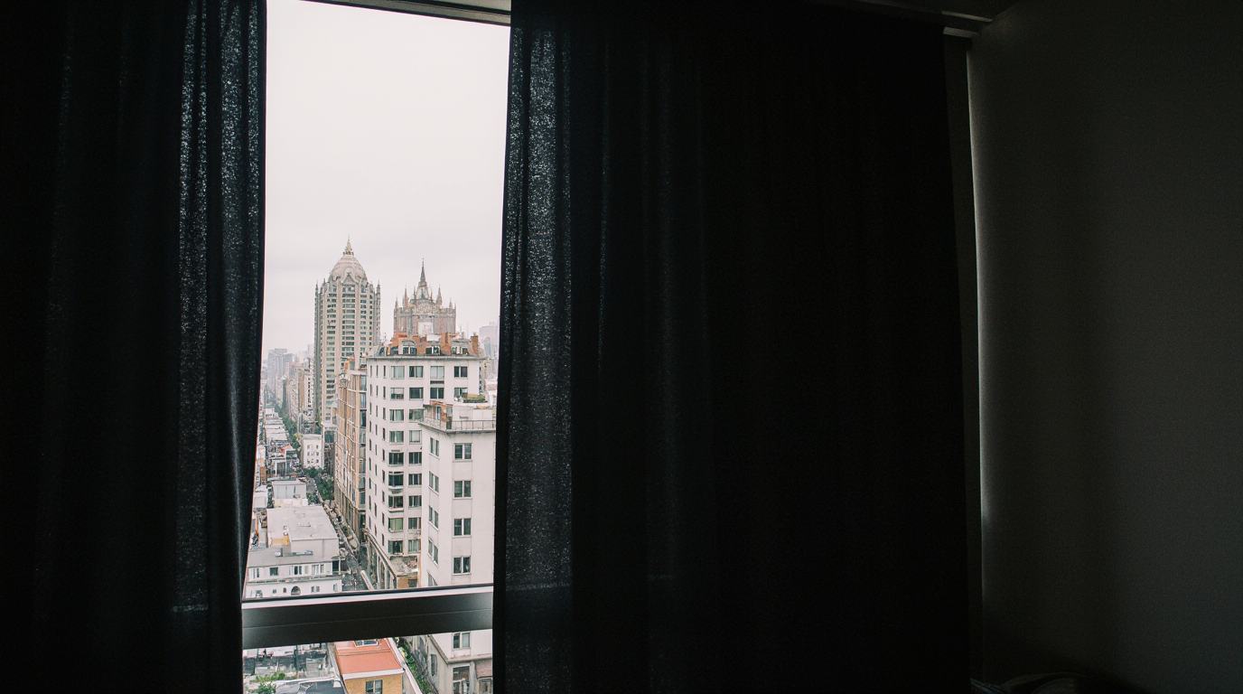 City view through partially closed blackout curtains
