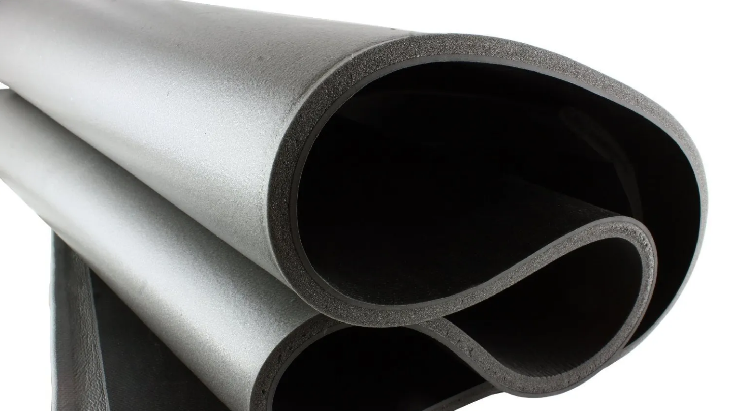 Rolled sheets of mass-loaded vinyl showing the dense, limp barrier material