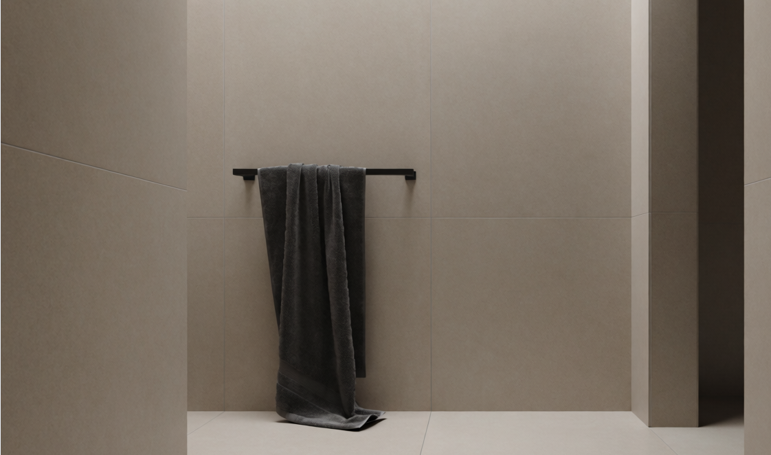 Minimalist tiled bathroom with towel on black rail